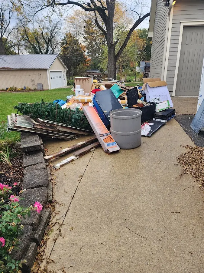 Dumpster being loaded with debris for Commercial Dumpster Rental in Willoughby Hills